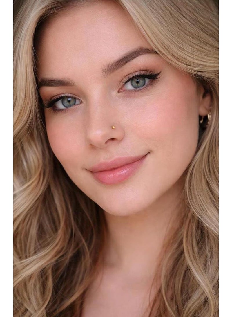 Luxuria These gold nose rings for women feature a simple and elegant design. Their small, delicate size creates a subtle yet understated look, while a small gold ball adds a touch of feminine charm. The design is suitable for everyday wear and easily complements various outfits. - Image 2