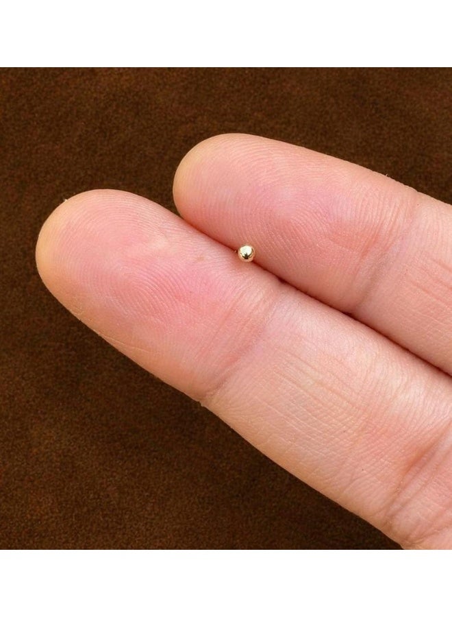 Luxuria These gold nose rings for women feature a simple and elegant design. Their small, delicate size creates a subtle yet understated look, while a small gold ball adds a touch of feminine charm. The design is suitable for everyday wear and easily complements various outfits. - Image 4