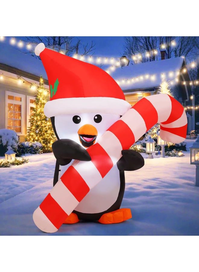 GOOSH 5 FT Height Christmas Inflatables Outdoor Penguin with Cane, Blow Up Yard Decoration Clearance with LED Lights Built-in for Holiday/Christmas/Party/Yard/Garden - Image 1