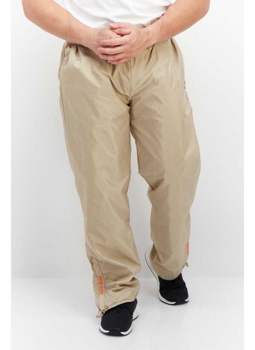 FILA - Men Sportswear Fit Brand Logo Training Track Pants, Beige - Image 1