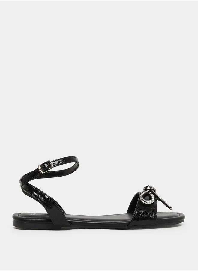 Styli Embellished Bow Detail Ankle Strap Flat Sandals