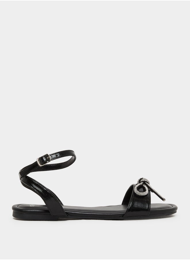 Styli Embellished Bow Detail Ankle Strap Flat Sandals  - Image 1