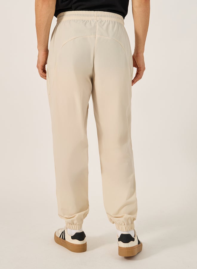 Styli Solid Relaxed Fit Elasticated Cuff Joggers with Contrast Zip detail  - Image 4