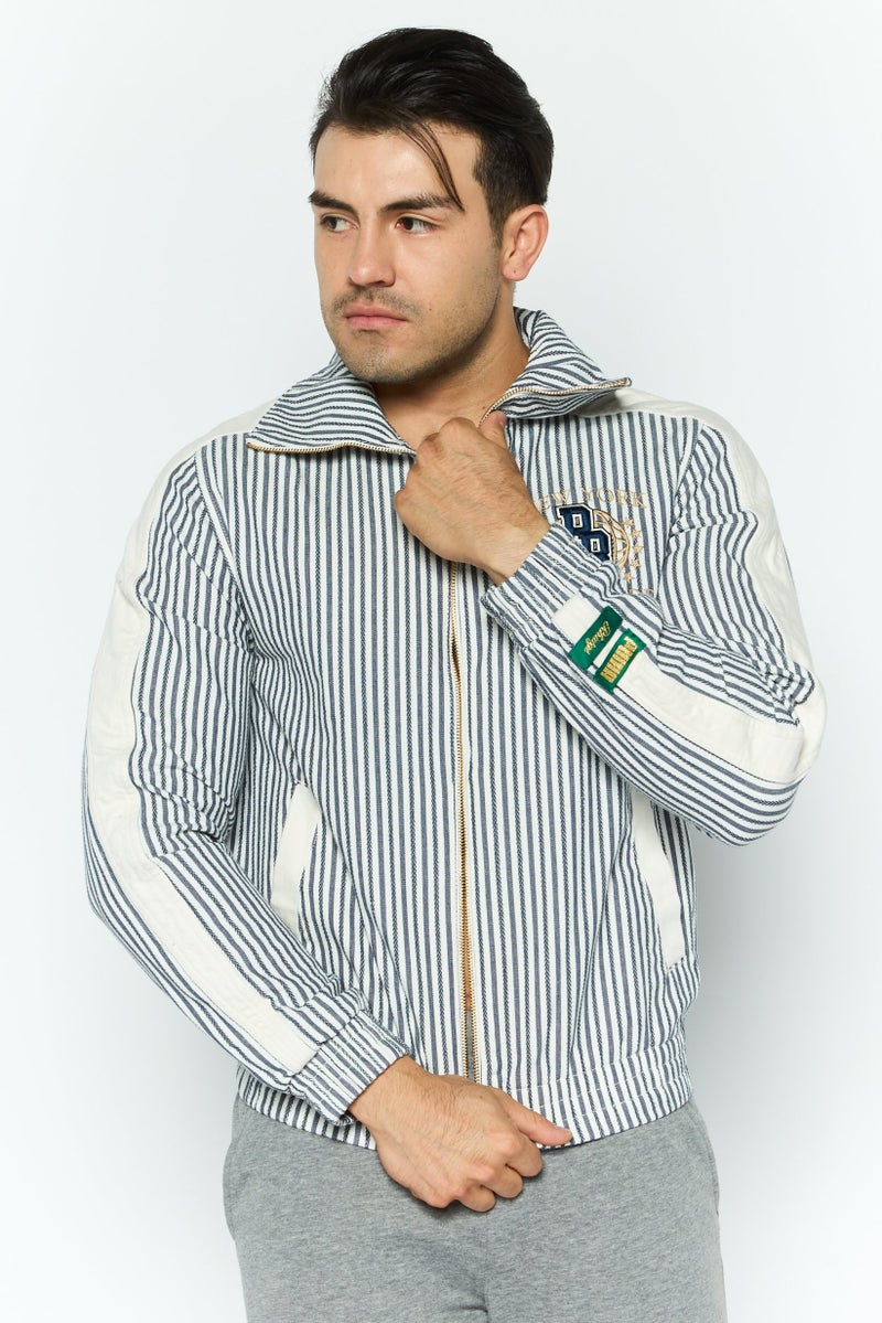 PUMA جاكيت رياضي للرجال بأكمام طويلة مناسب للخارج، أزرق داكن - Image 1