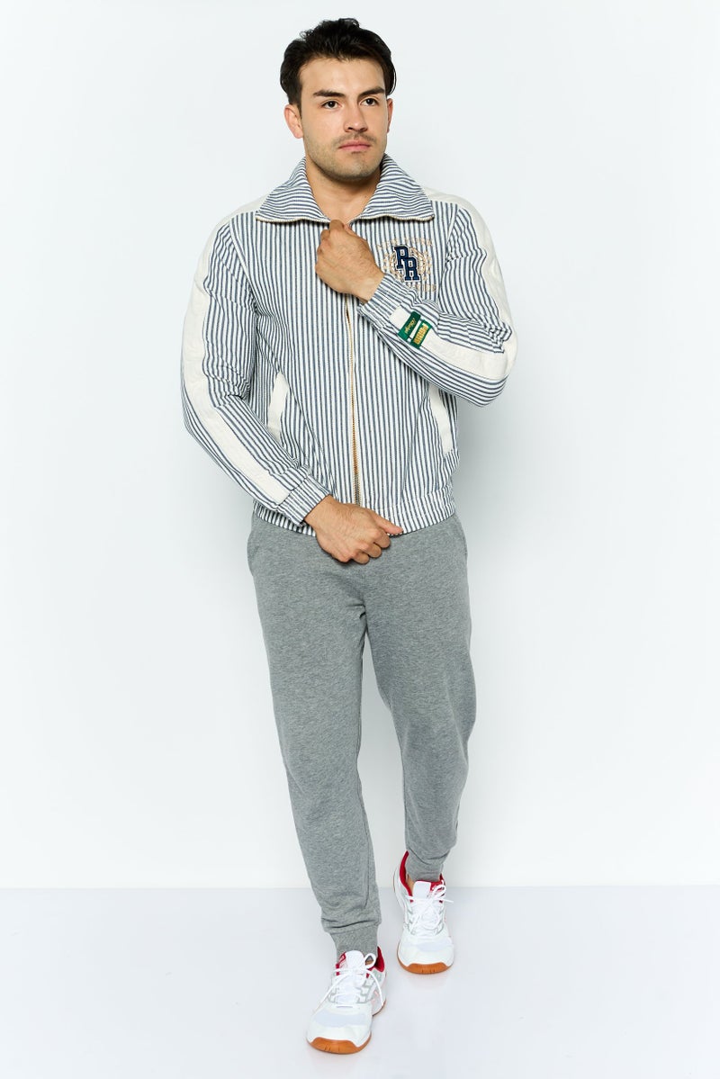 PUMA جاكيت رياضي للرجال بأكمام طويلة مناسب للخارج، أزرق داكن - Image 2