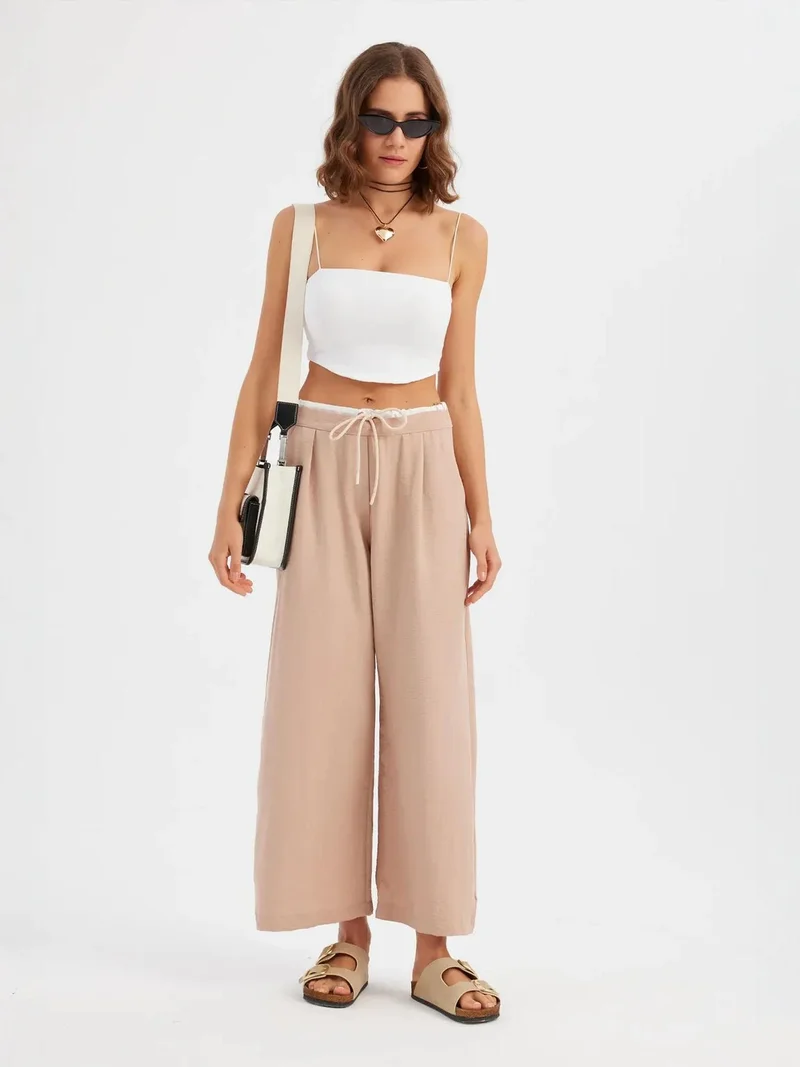 هيكاب بنطلون واسع الساق بخصر منخفض وحبل شد