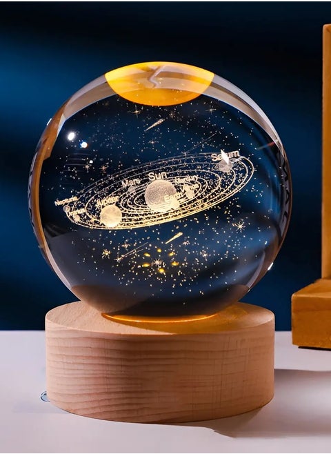 3D crystal ball with yellow night light, small battery operated lamp, wooden base, solar array, space