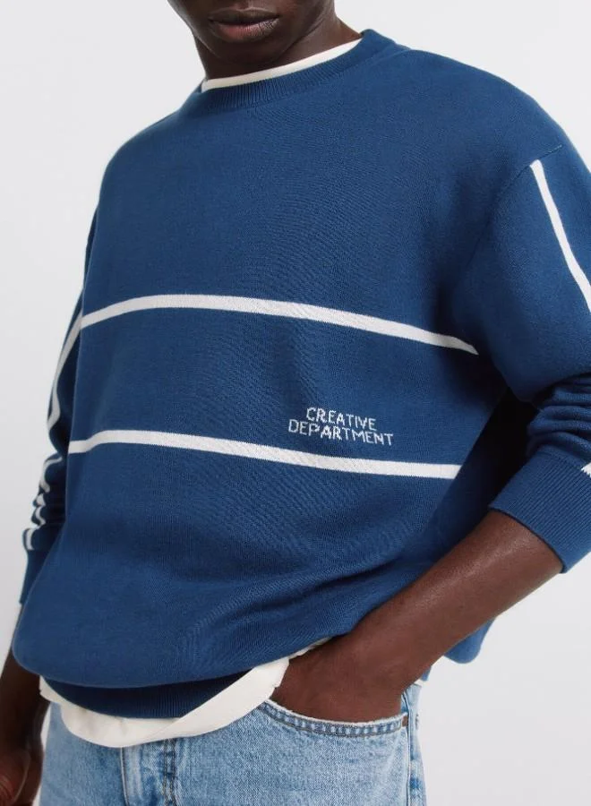 Springfield  100% cotton plain jersey-knit jumper with jacquard positional text, ribbed neck, cuffs and hem for Men | Best Price UAE