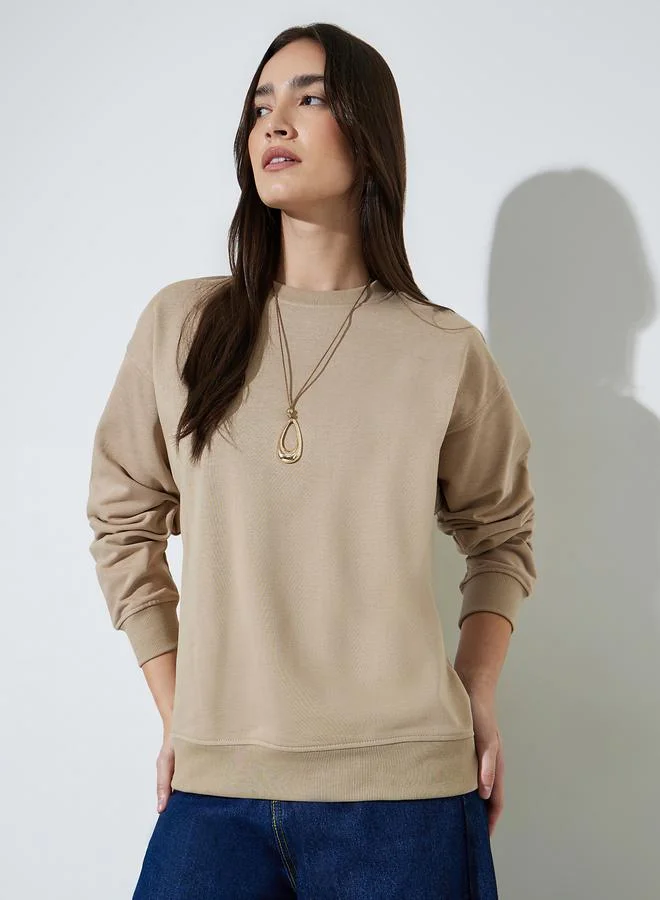 ستايلي Beige Solid Oversize Pullover Sweatshirt