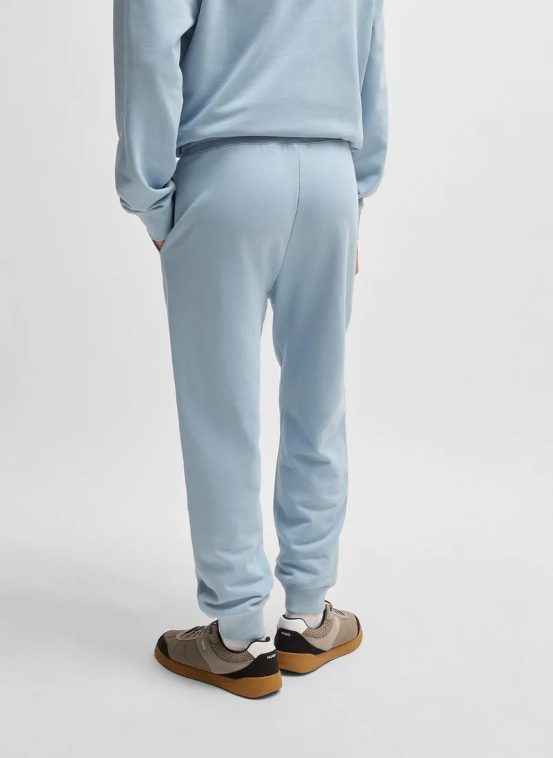 HUGO Cotton-terry tracksuit bottoms with logo print