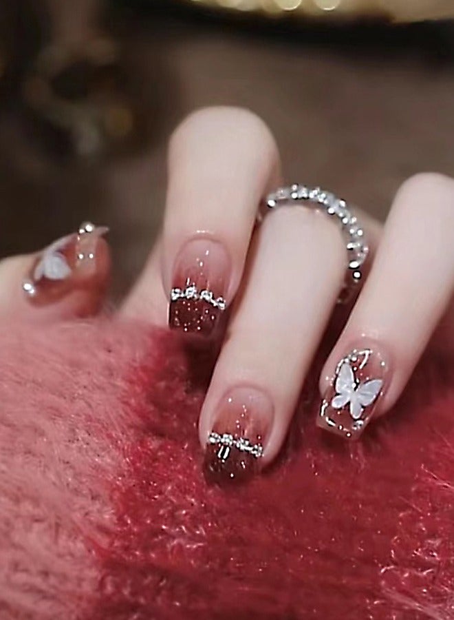 NIBEMINENT 24 قطعة أظافر صناعية، أظافر صناعية في علبة، أظافر صناعية قصيرة ذات رأس مسطح بلون وردي أحمر متدرج، أظافر صناعية لامعة، زركون على شكل فراشة بيضاء، رقعة أظافر صناعية - Image 1