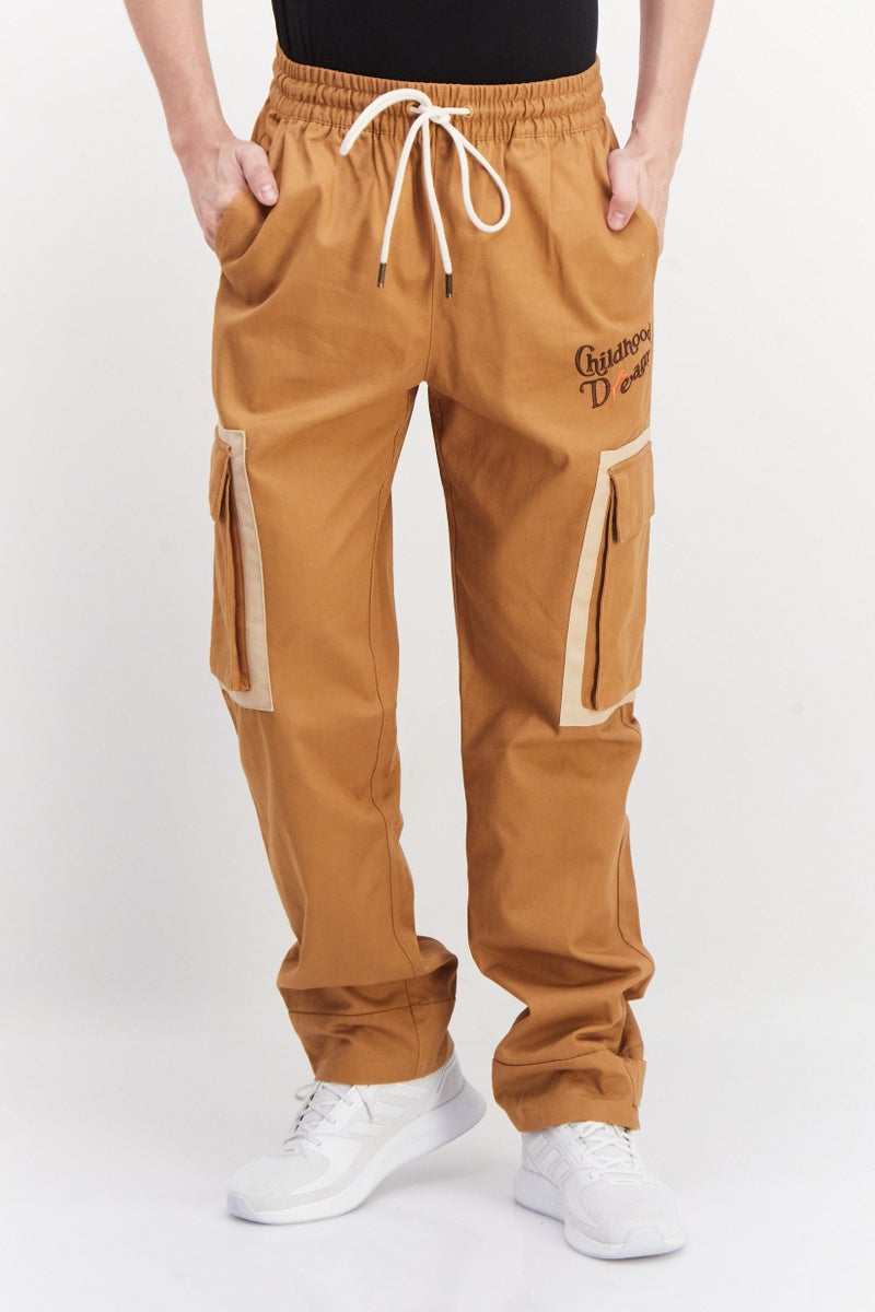 PUMA Men Sportswear Fit Outdoor Trouser Pant, Desert Tan - Image 1