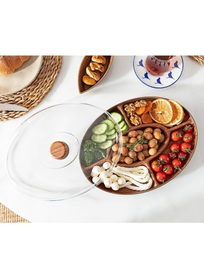 إيفيلين طبق تقديم خماسي أنيق مصنوع من بوليستيرين متين بتصميم يشبه الخشب الطبيعي، مزود بغطاء شفاف يحافظ على الطعام. يأتي بمقاس 30×20 سم مع خمسة أقسام منظمة لتقديم المكسرات، الحلويات، السناكس، الفواكه والمقبلات. يتميز بمظهر راقٍ وخامة مقاومة للكسر وسهولة في الاستخدام والتنظيف، مما يجعله خيارًا مثاليًا للمنزل والحفلات والضيافة اليومية. - Image 5