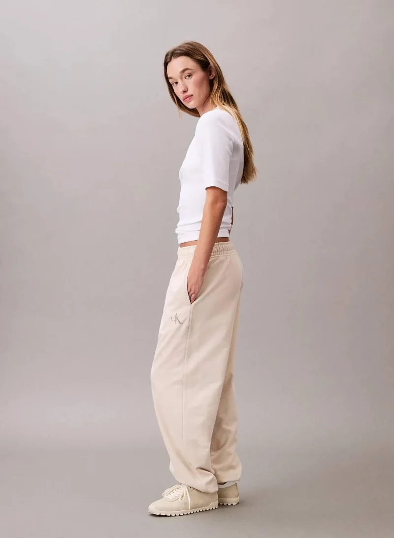 Calvin Klein Jeans Light Hay Monogram Logo French Terry Jogger for Women | Best Price UAE