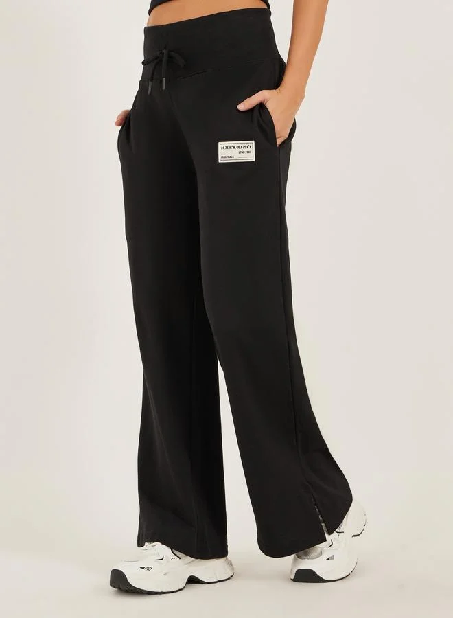 Styli Styli Badge Detail Wide Leg Joggers with Side Slit