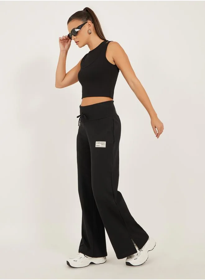 Styli Styli Badge Detail Wide Leg Joggers with Side Slit