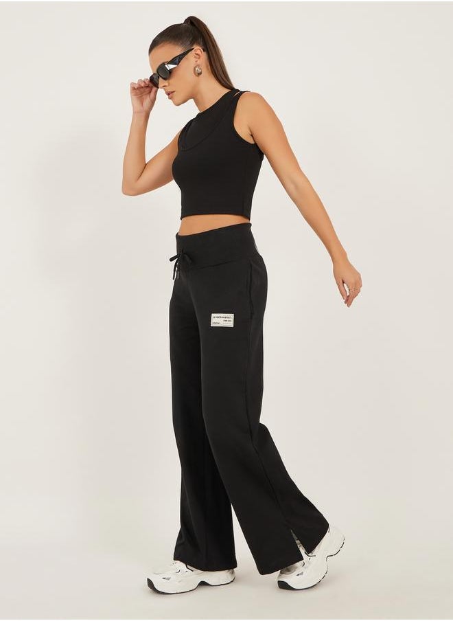 Styli Styli Badge Detail Wide Leg Joggers with Side Slit  - Image 1