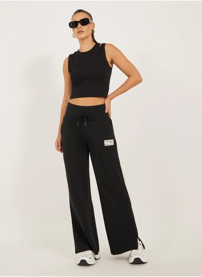 Styli Styli Badge Detail Wide Leg Joggers with Side Slit