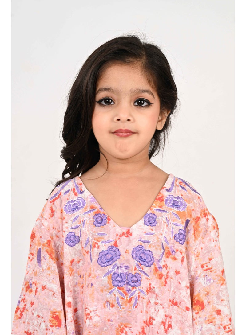 Linelle Kids Jalabiya – Orange Abstract Print with Purple Floral Embroidered Neckline - Image 1