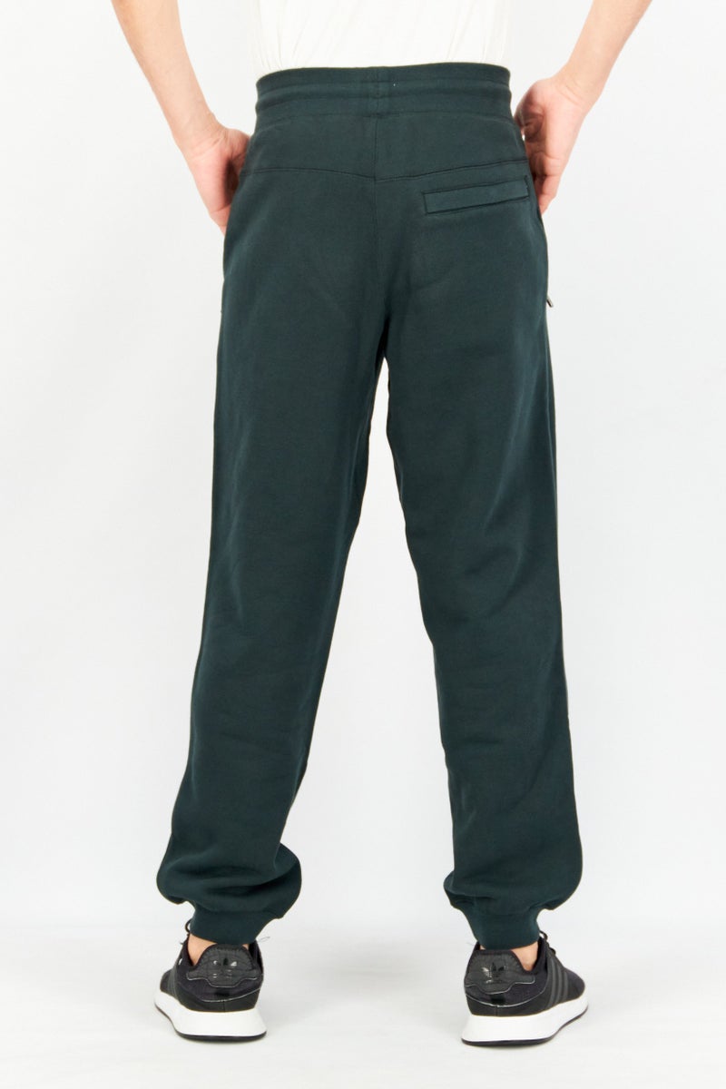PUMA Men Sportswear Fit Embroidered Logo Training Jogger Pants, Dark Green - Image 4