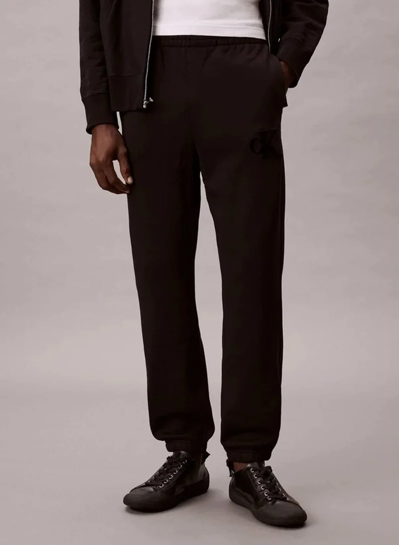 Calvin Klein Jeans Black Fleece Monogram Logo Patch Joggers for Men | Best Price UAE