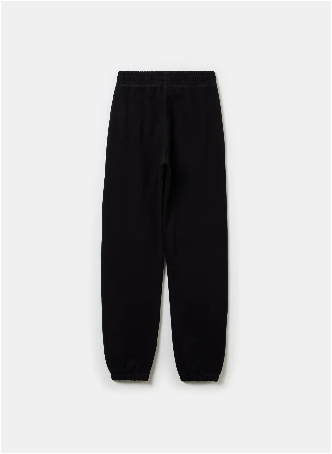 او في اس Joggers in fleece with elasticated edging and print