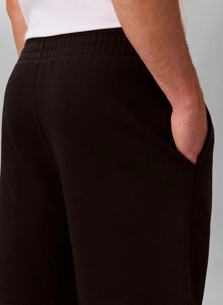 Calvin Klein Jeans Black Premium Terry Graphic Shorts for Men | Best Price UAE