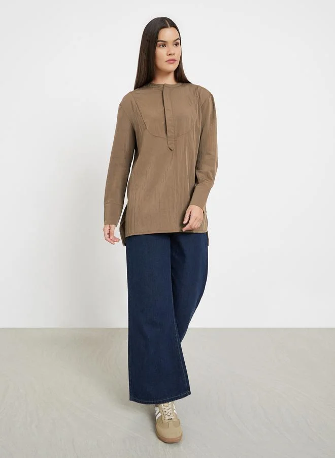 ستايلي بلوزة تونيك سادة بأكمام طويلة وشريط أزرار