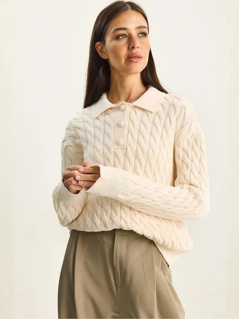 بيانكو لوتشي كنزة بولو برقبة سميكة بنقش ضفيرة لوتشي