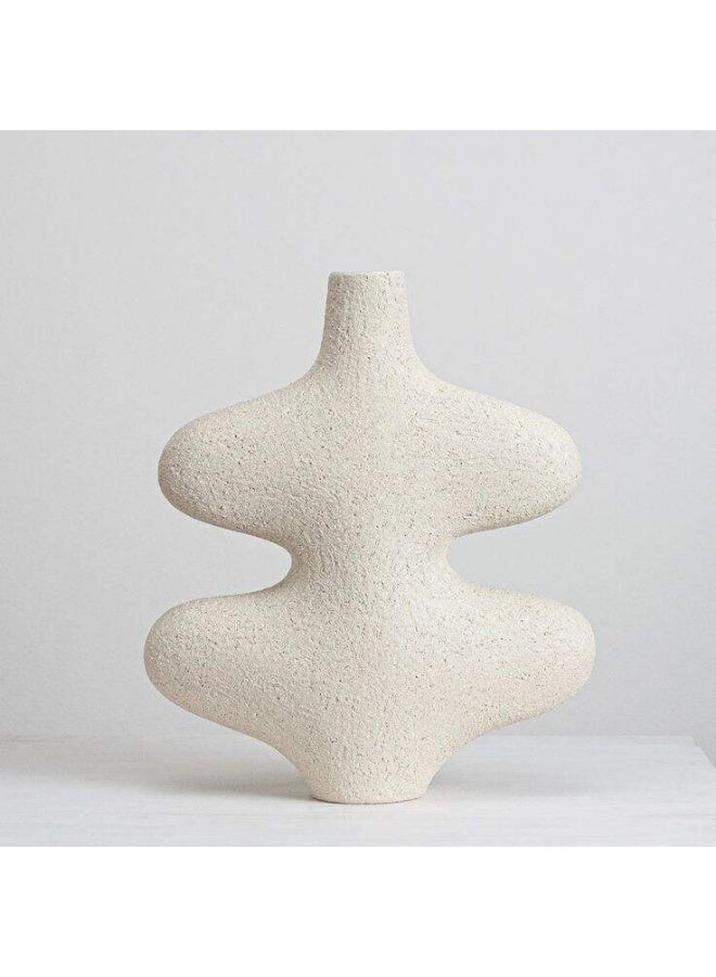 A wavy ceramic vase with an artistic design that adds a touch of elegance to your home. White color.