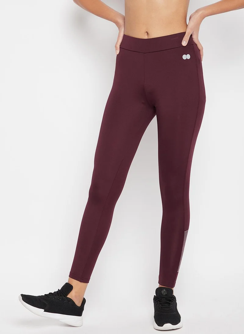 كلوفيا Clovia Snug Fit High Rise Active Tights in Plum Colour