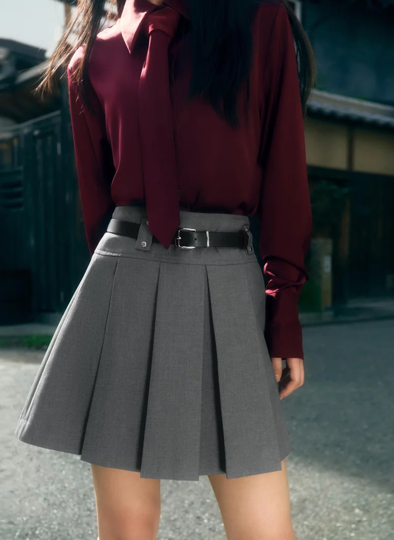 Lichi Mini pleated skirt with eco-leather belt