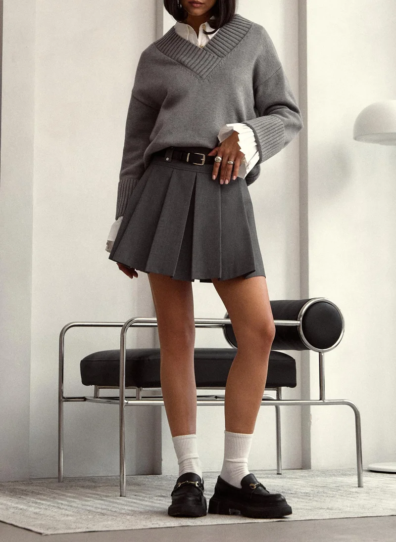 Lichi Mini pleated skirt with eco-leather belt