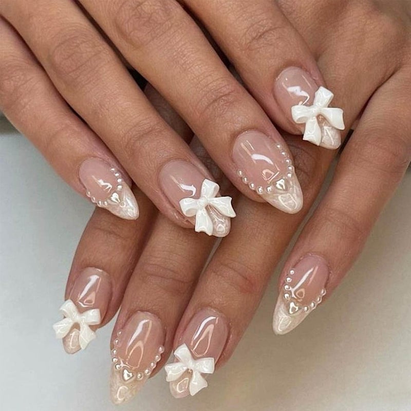 LRKNNO 24pcs Almond Shaped Artificial Nails - French Tips with Cute Bow Charms Design - Nude Pink Acrylic Nails for Women & Girls - Image 1
