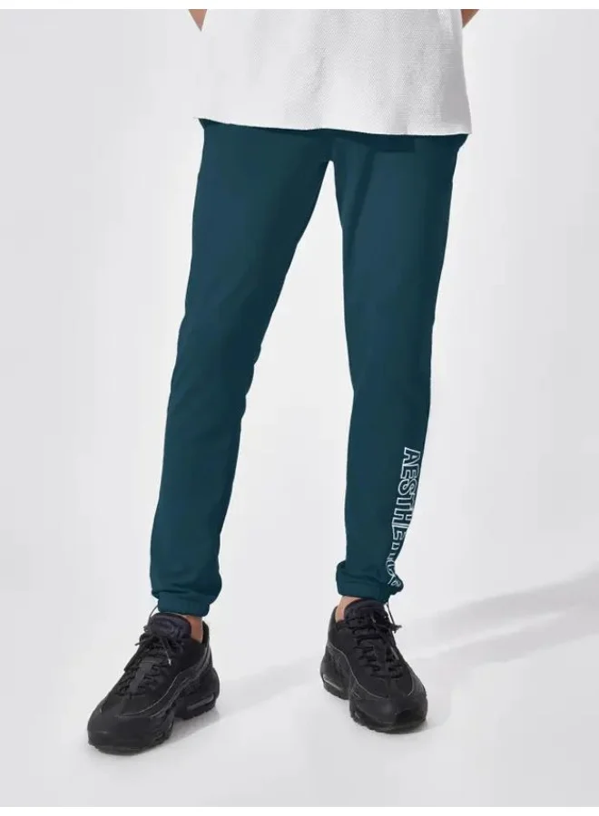Maniac  Maniac Mens Printed 95% Polyester 5% Lycra French Terry fabric Denim Blue Slim Fit Trackpant for Men | Best Price UAE
