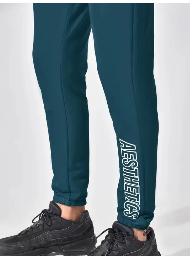 مانياك بنطلون رياضي رجالي أزرق سماوي بقصة ضيقة من نسيج فرنسي تيري بوليستر وليكرا بطبعة مانياك