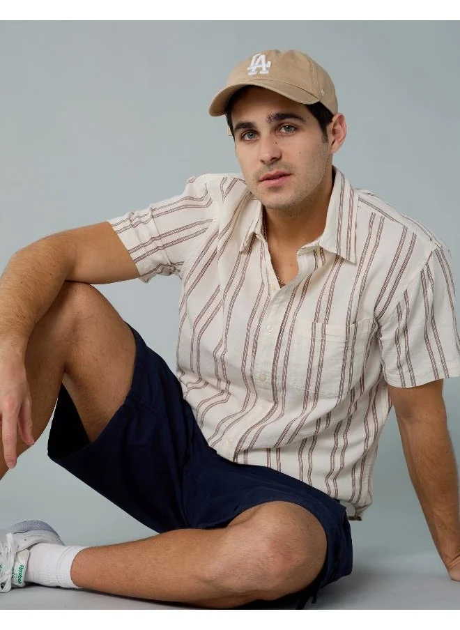 American Eagle An easy, stylish button-up shirt made for kicking back, going out, and everything in between. No pool required!