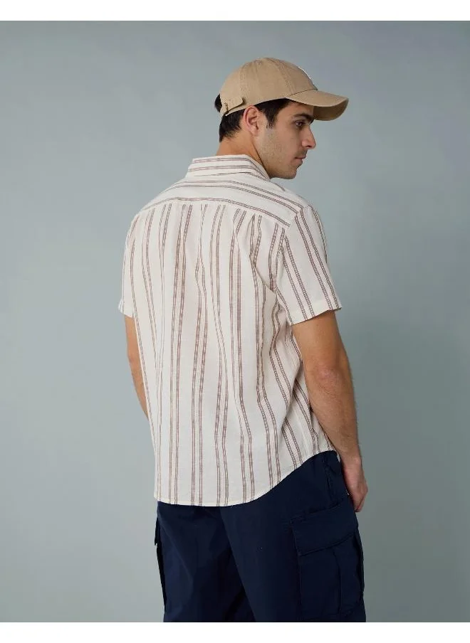 American Eagle An easy, stylish button-up shirt made for kicking back, going out, and everything in between. No pool required!