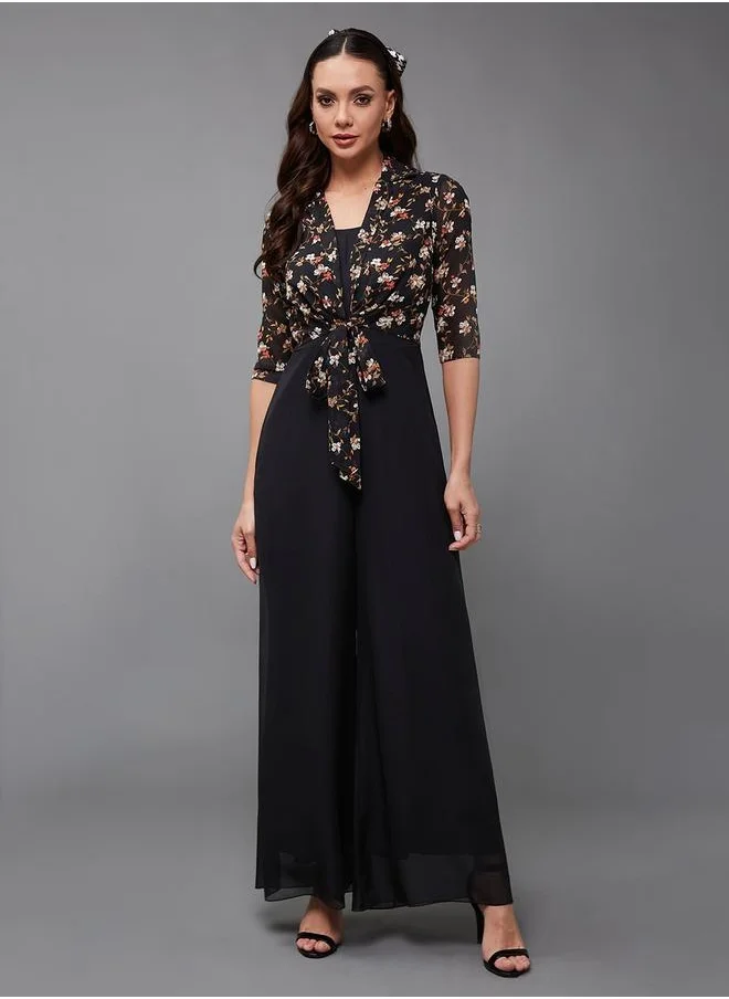 Styli Floral Print Round Neck Wide Leg Jumpsuit with Tie-Up Detail