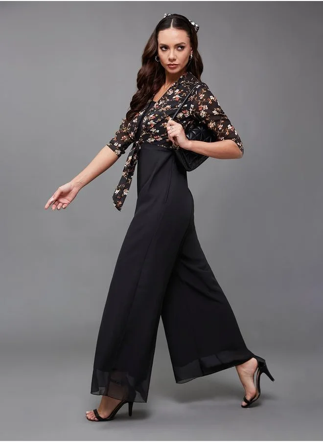 Styli Floral Print Round Neck Wide Leg Jumpsuit with Tie-Up Detail