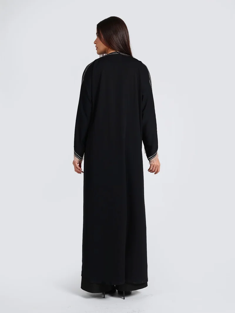 Reem Abayas  Sophisticated Black Abaya with White Contrast Stitching & Fringed Cuffs for Women | Best Price UAE