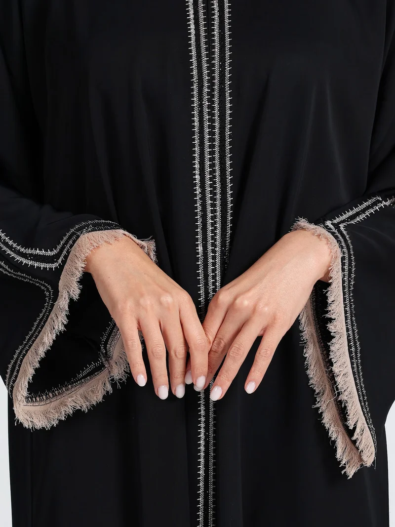 Reem Abayas  Sophisticated Black Abaya with White Contrast Stitching & Fringed Cuffs for Women | Best Price UAE