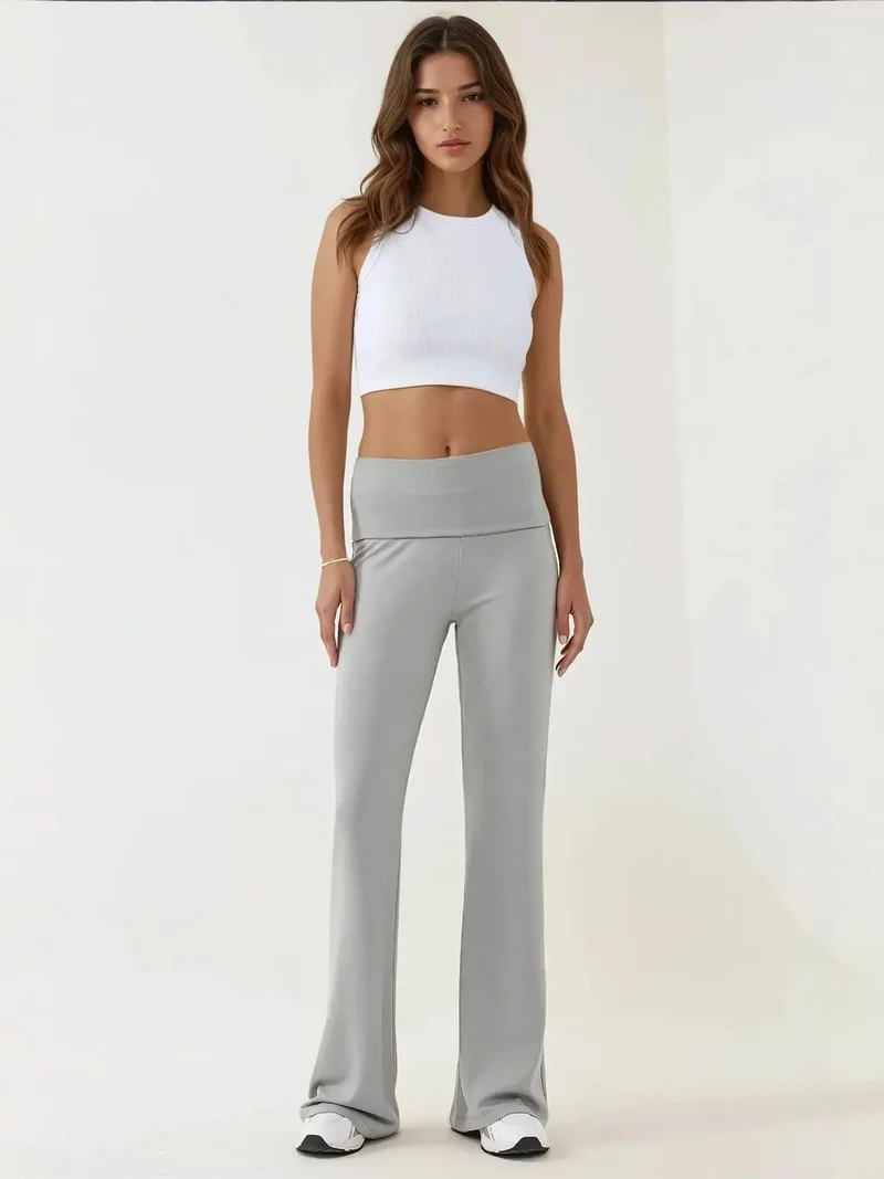 زوبعة بنطلون ضيق بخصر عالٍ وأرجل واسعة