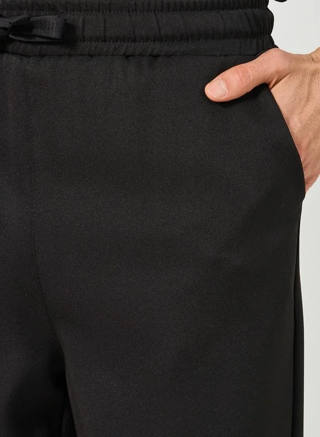 Styli Solid Loose Fit Mid Rise Pants with Drawstring