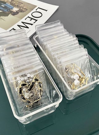 100 Pack Clear Jewelry Bags Clear Zipper Plastic Bag Self Seal PVC Rings Earrings Packing Pouch Storage Bags for Holding Jewelries (1.5 x 2.5 Inch(4x6cm)) - https://f.nooncdn.com/p/pzsku/Z1259B8898C461BD2F901Z/45/_/1690265645/5607df92-282d-441c-81f2-e59820486ec6.jpg