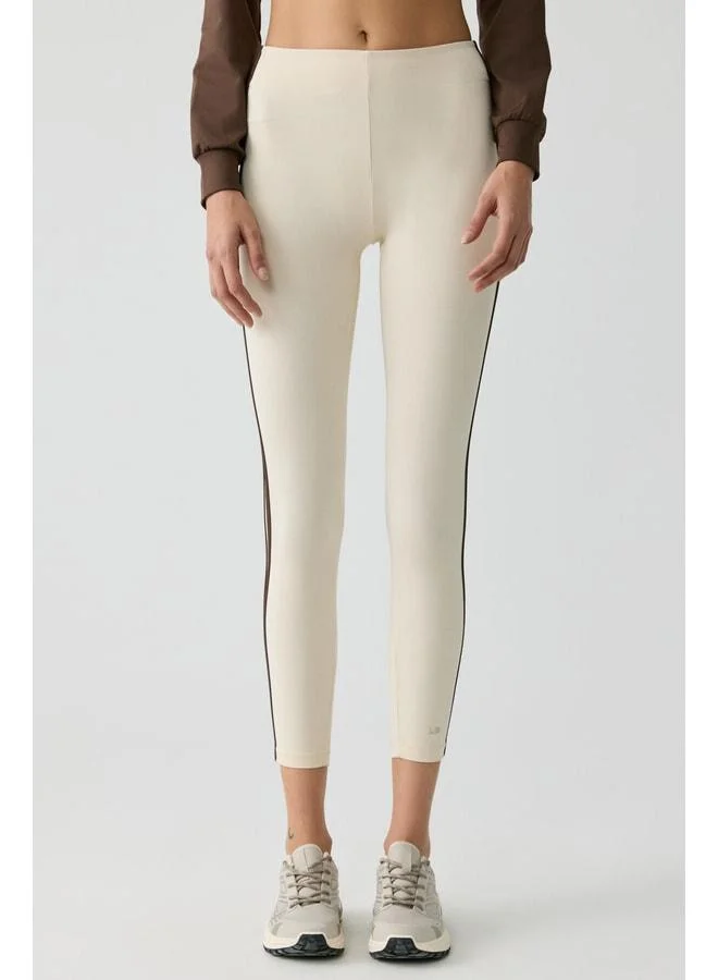Urban Beat Lolita Women's Side-Stripe Piped Soft Cream Leggings.