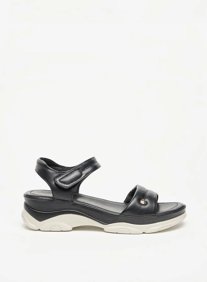 فلورا بيلا من شو إكسبرس Womens Solid Strap Sandals With Hook And Loop Closure