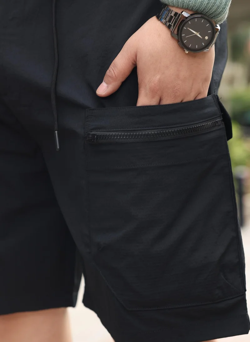 Instafab Plus  Instafab Plus Men Modular-Utility Shorts | Mid-Rise , Elasticated -Waistband | Button Closure , Straight Hem | Solid Textured | Woven Fabric For Street & Casual Wear | Onyx Black for Men | Best Price UAE