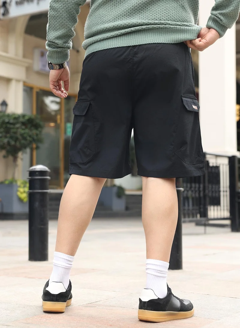 Instafab Plus  Instafab Plus Men Modular-Utility Shorts | Mid-Rise , Elasticated -Waistband | Button Closure , Straight Hem | Solid Textured | Woven Fabric For Street & Casual Wear | Onyx Black for Men | Best Price UAE