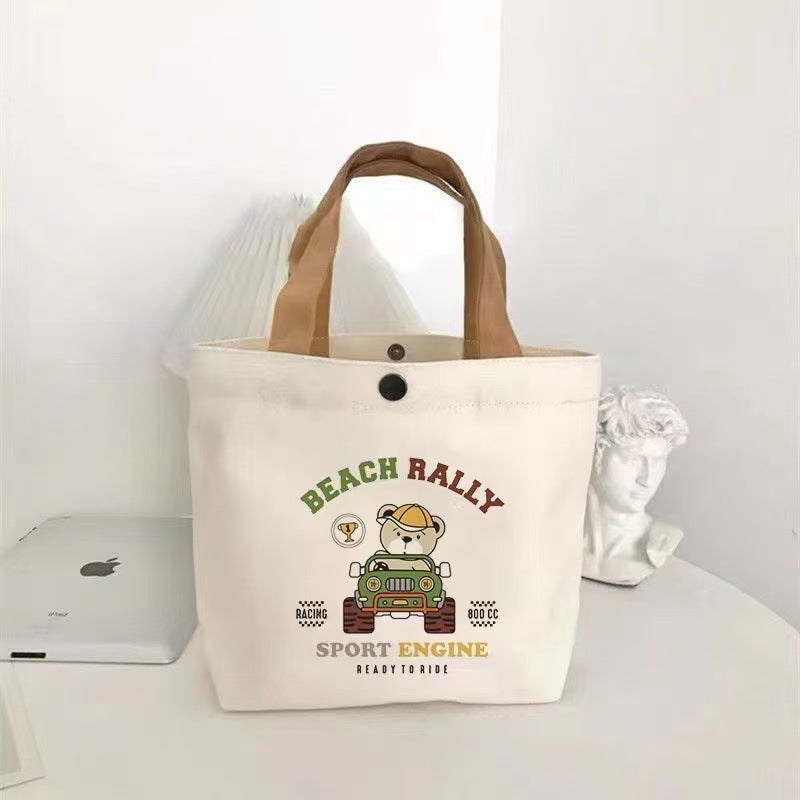 New Small Bear Canvas Bag Casual Commuter Lunch Bento Box Handheld Eco-Friendly Bag Student Portable Multi-Functional Leisure Bear driving 